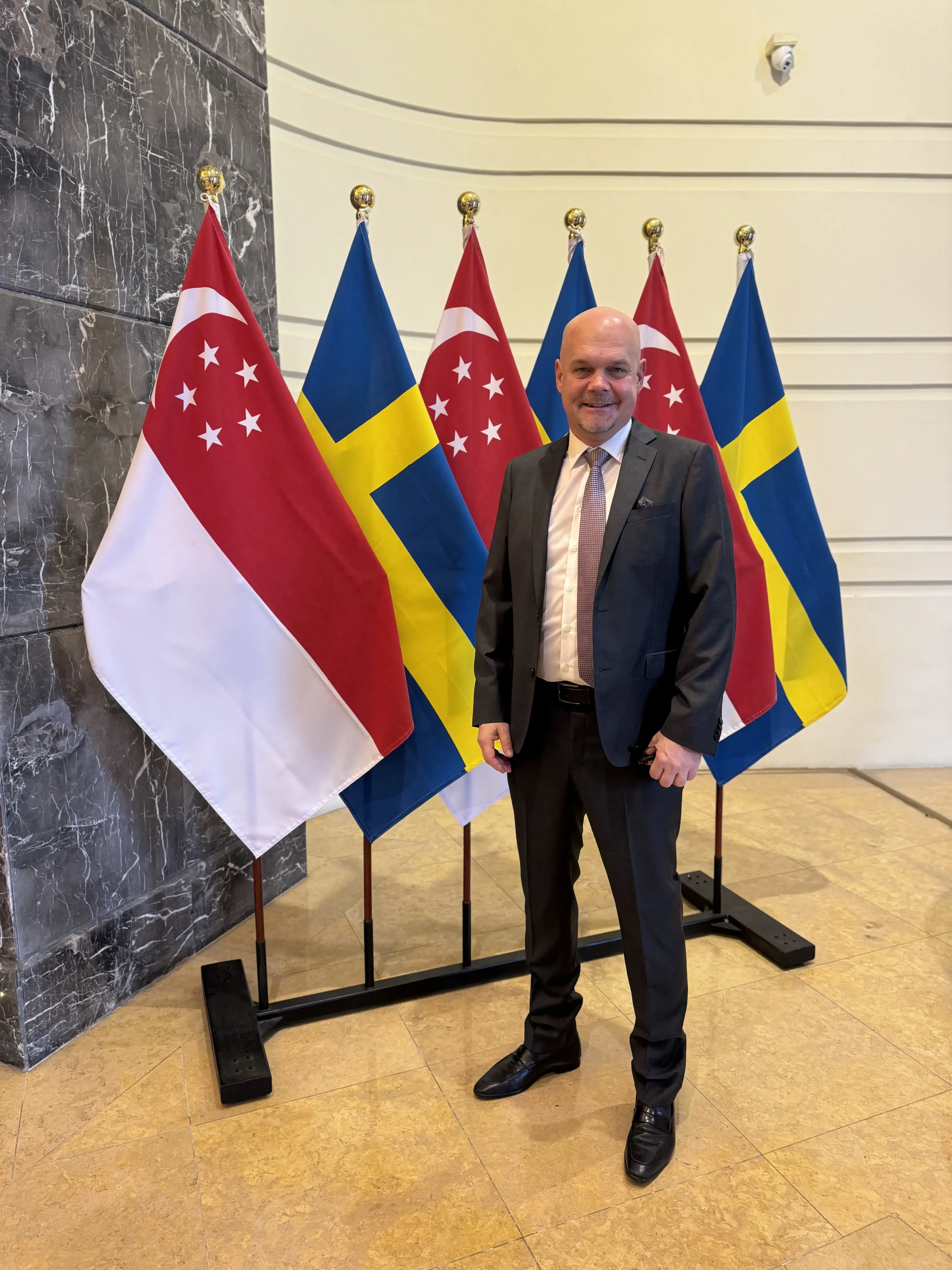 Pierre at a business event featuring delegates from Singapore and Sweden.