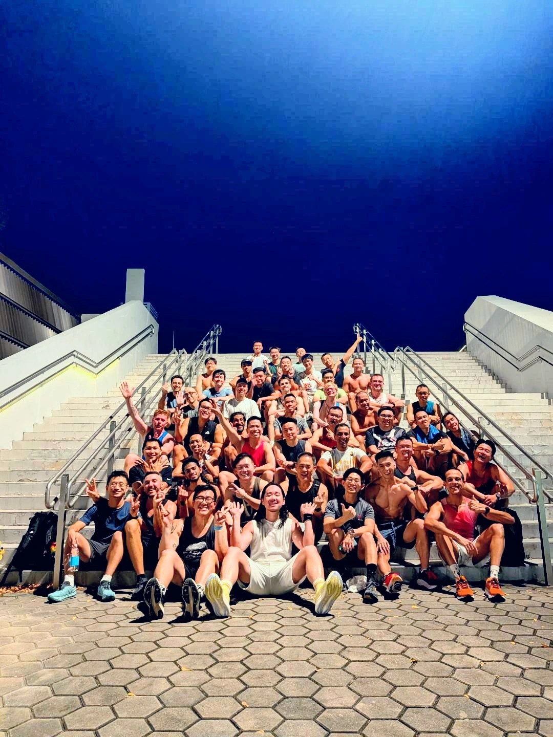 Kelvin with a group of Singaporean runners at the Kenzo Tange Indoor Stadium Grounds
