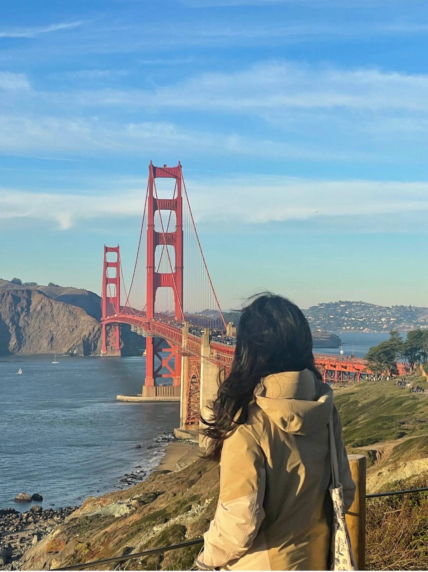 Grace admiring the Golden Gate bridge in San Francisco.