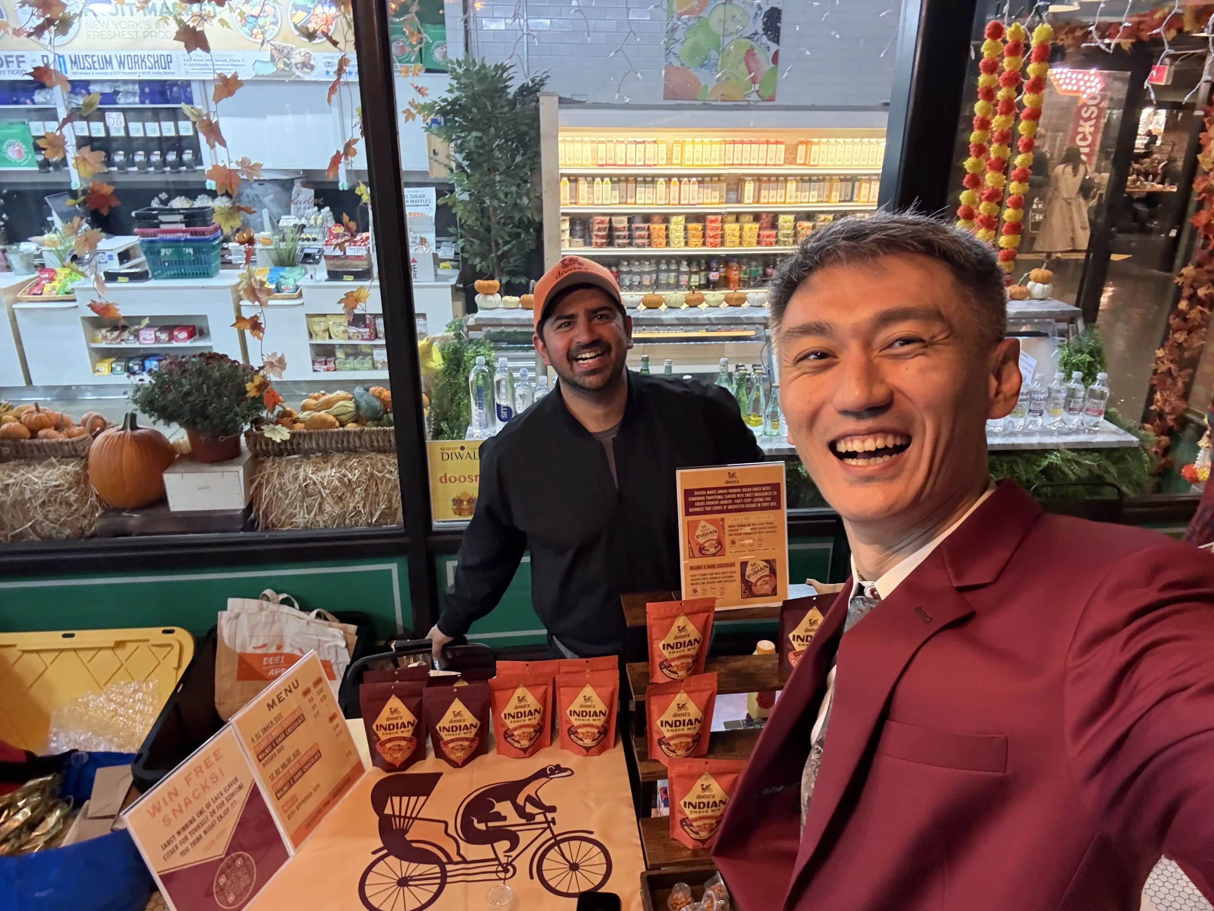 Kartik engaging with a customer at a farmer’s market.